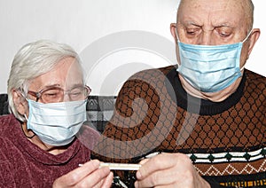 Elderly couple in a medical mask