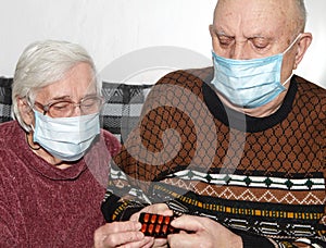 Elderly couple in a medical mask