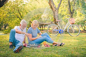 Elderly couple enjoying in garden at sunset. Concept couple elder love