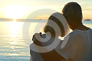 Elderly couple rest at tropical beach