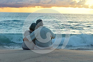 Elderly couple rest at tropical resort