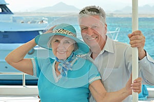 Elderly couple ride in boat on sea