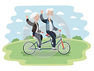 Elderly couple riding a bicycle