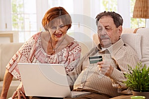 Elderly couple shopping online