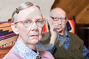 Elderly Couple Sitting in Livingroom