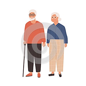 Elderly couple standing together. Grandfather with walking stick and grandmother. Senior man and woman on white