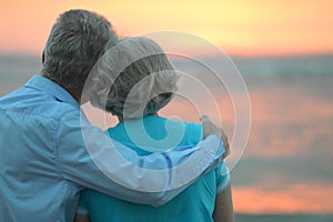 Elderly couple at sunset