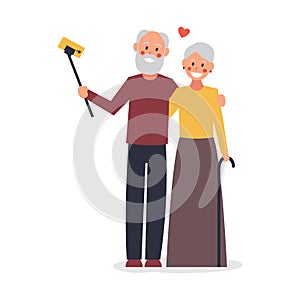 An elderly couple takes a selfie. Old people using modern technology. Elderly man and woman smiling and taking selfie