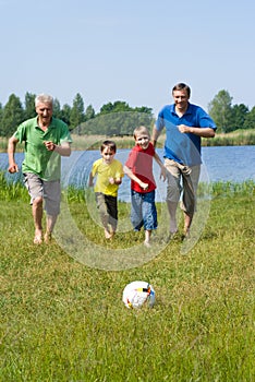 Elderly couple with their grandchildren