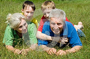 Elderly couple with their grandchildren