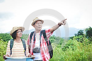 Elderly couple travel and hiking