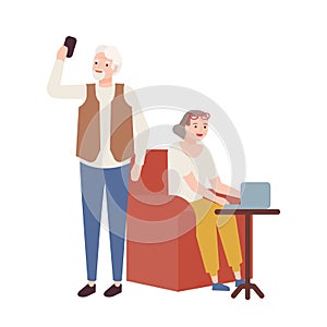 Elderly couple using modern devices. Grandmother working on laptop and grandfather taking selfie on smartphone. Smiling