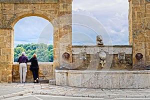 Elderly couple watching the view from the village of Pitigliano