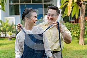 Elderly couples, men are wearing aprons for wives, Valentines Day concept, happy family concept photo