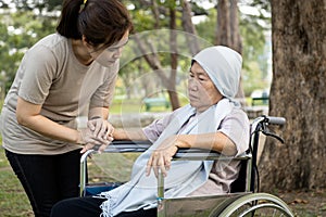 Elderly with depressive symptoms need close care,female caregiver is care,supporting,Alzheimer patient,depressed asian senior