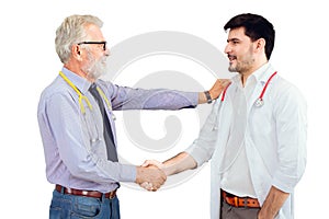 Elderly doctor professor shakes hands to congratulate the new young doctor student isolated on white background