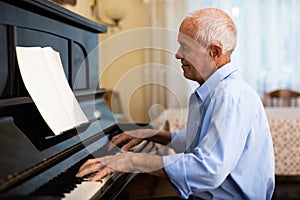 Compositor creating new music with piano at home photo