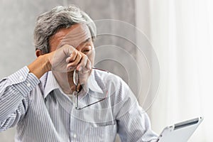 elderly eye irritation problem fatigue and tired from hard work or computer vision syndrome