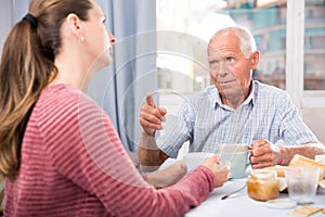 Elderly father threatens finger of her adult daughter