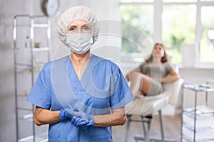 Elderly female doctor with mask