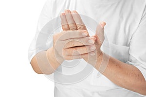 Elderly female hands patient suffer from numbing pain in hands photo