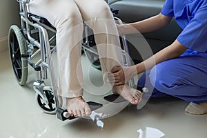 Elderly female patient with Asian female physical therapist holding her arm for physical therapy Rehabilitate weak muscles. photo