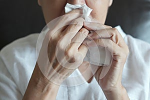 Elderly female robes feeling unwell just caught cold