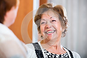 Elderly friends having nice conversation