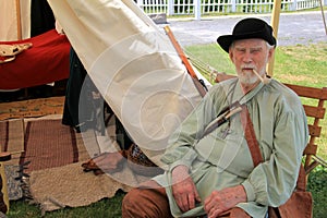 Elderly gentleman dressed in period clothing during reenactment of French and Indian War, Fort Ontario, 2016