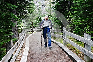 Elderly Gentleman hiking on a trail