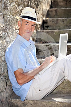 Elderly gentleman working outdoors