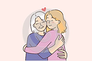 Elderly grandmother hug happy grownup daughter