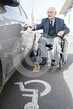 elderly handicapped man opening car door