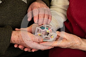 Elderly hands & carer`s hands