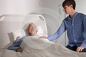 Elderly hospice patient with caregiver