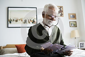 An elderly Indian man at the retirement house photo