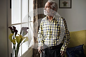 An elderly Indian man at the retirement house photo