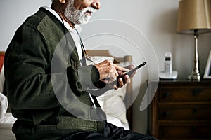 An elderly Indian man at the retirement house photo