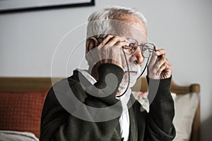 An elderly Indian man at the retirement house photo