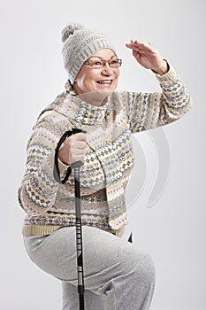 Elderly lady with hiking poles