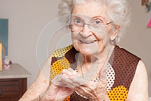 Elderly Lady looking at her dry hands