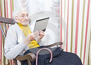 Elderly lady new technology photo