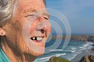 Elderly lady pensioner with dental problems and a tooth missing