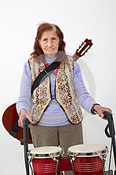 Elderly lady with rollator and musical instruments