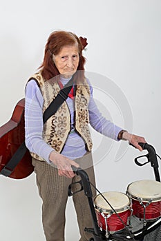 Elderly lady with rollator and musical instruments