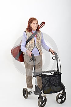 Elderly lady with rollator and musical instruments