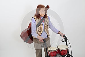 Elderly lady with rollator and musical instruments