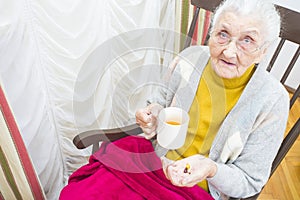 Elderly lady taking medication
