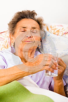Elderly Lady Taking Meds