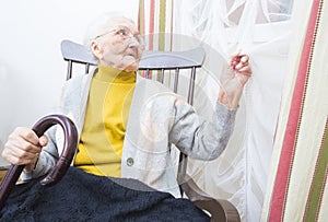 Elderly lady waiting for visitors